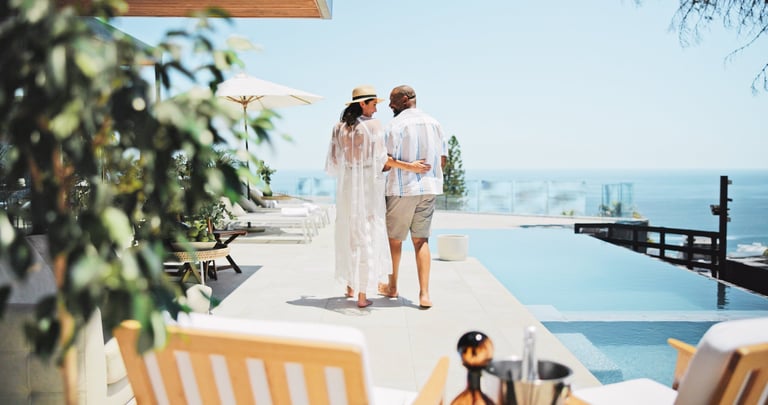 Romantic couple enjoying honeymoon tropical island swimming pool sunset