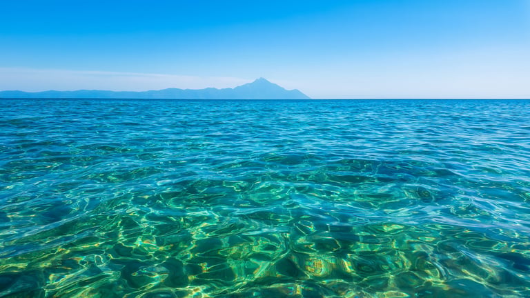 Beautiful Greek beach crystal clear waters and summer skies
