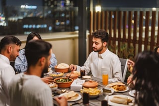 Arabic friends having dinner on rooftop