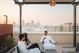 Middle Eastern friends relaxing at night