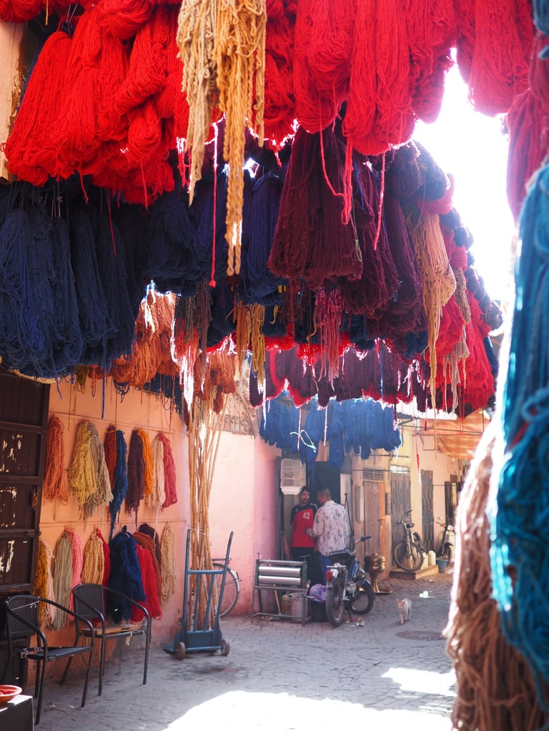 Vibrant yarn in sunlight Marrakech medina traditional market